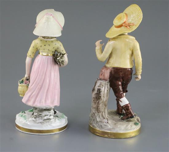 A matched pair of Rockingham porcelain figures of a Swiss boy and Swiss girl, c.1830, h. 21cm and 19.5cm, small losses